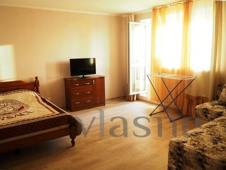 The room has a large double bed and a double sofa. Equipped 
