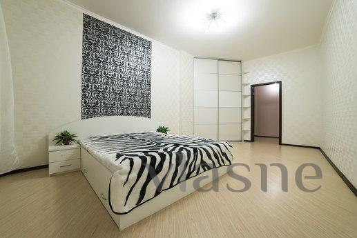 Furniture and other amenities such as a sofa, bed, kitchen, 