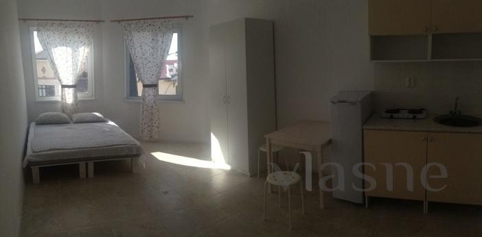 Studio with its kitchenette and bathroom in the 4-storey apa