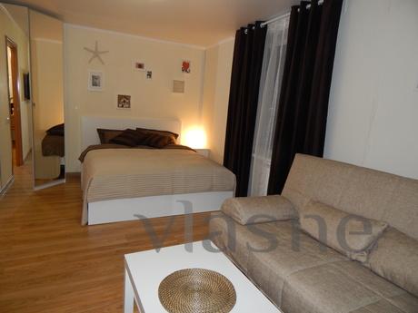 The apartment is small but cozy, modernly equipped and locat