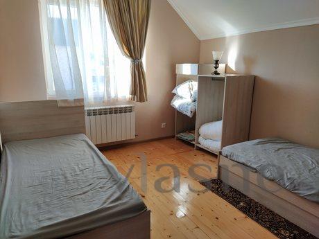 Bedroom with 2 single beds, sideboard, wardrobe and reading 