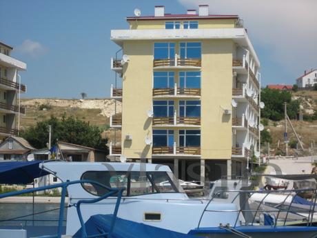 The apartment is located on the shore of the bay (25 m from 