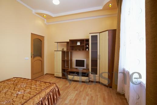 This apartment is located in a tiny Lviv street facing Opera